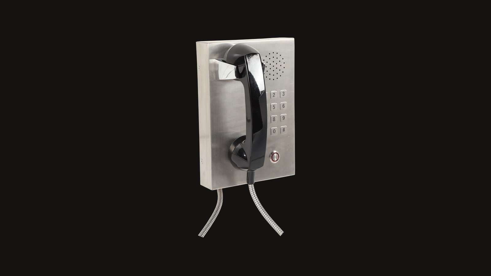 Stainless steel industrial telephone on a dark background